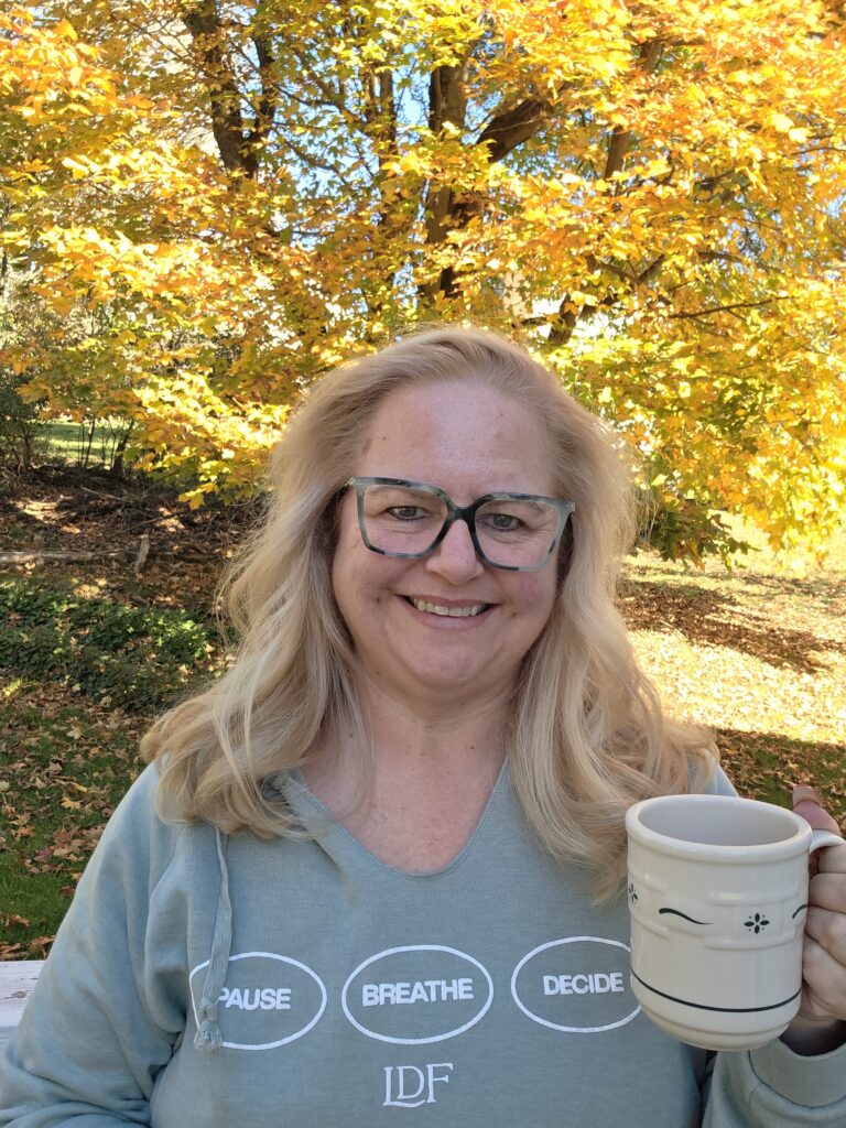 Amy smiling in an autumn setting